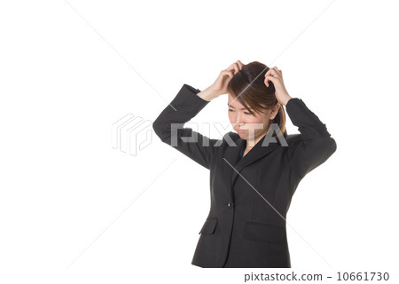 Business woman holding a head Business woman holding a head 10661730