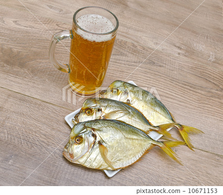 smoked Vomer and glass of lager beer on a wooden table smoked Vomer and glass of lager beer on a wooden table 10671153