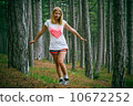 Young Woman walking in Coniferous deep Forest beautiful green summer landscape outdoor lifestyle 10672252