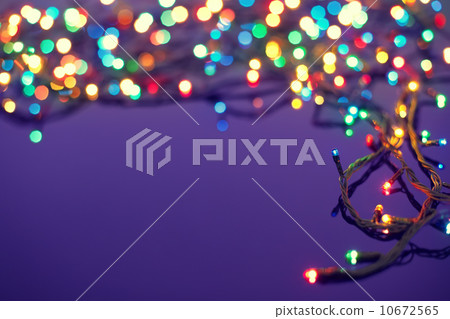 Christmas lights on dark blue background with copy space. Decora Christmas lights on dark blue background with copy space. Decora 10672565