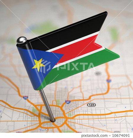 South Sudan Small Flag on a Map Background. 10674091