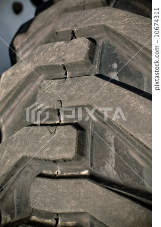 Giant old damaged tire 10674311