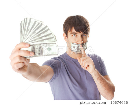 Young man holding a dollar bills  his mouth sealed by hundred do 10674626