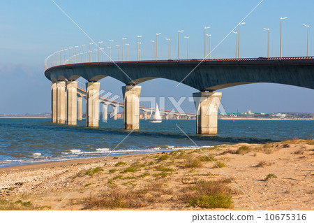 Curved Concrete Bridge over the water Curved Concrete Bridge over the water 10675316