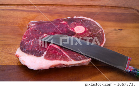 Raw meat with national uzbek knife Raw meat with national uzbek knife 10675733