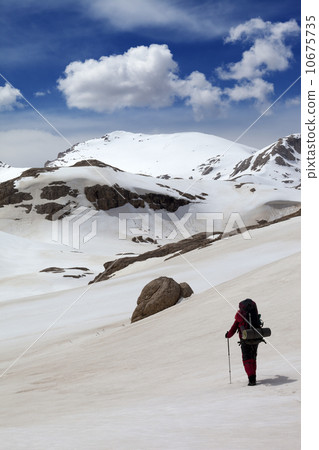Hiker in snow mountains Hiker in snow mountains 10675735