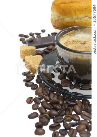 Cappuccino, brown sugar and coffee beans on white background Cappuccino, brown sugar and coffee beans on white background 10677694