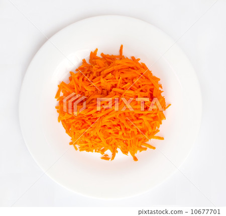 shredded carrots on a white plate 10677701