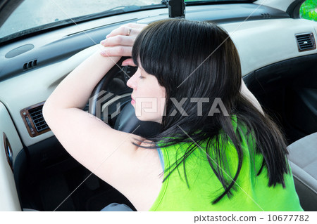 Young girl sleeps in her car 10677782