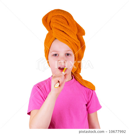 Girl brushing her teeth on a white background Girl brushing her teeth on a white background 10677992
