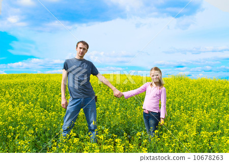 The father with a daughter on a meadow The father with a daughter on a meadow 10678263