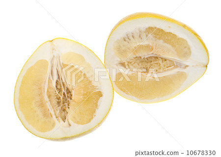 Cut a large yellow honey pomelo on white background 10678330