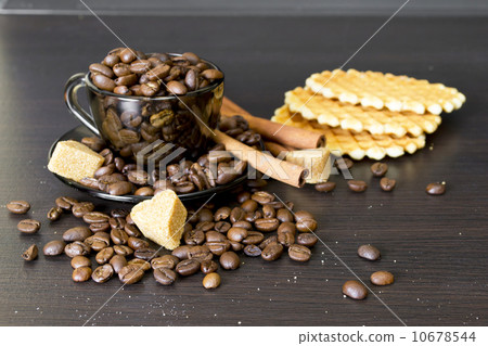 coffee beans, cup, Pots, cinnamon on dark background 10678544