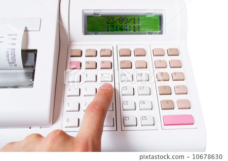 Close-up image of a shop-assistant's hand pressing a key of an e 10678630
