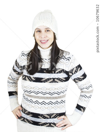 Pleased girl in warm winter sweater and hat isolated on white Pleased girl in warm winter sweater and hat isolated on white 10679632