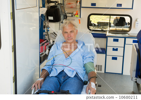 Injured man on stretcher in ambulance car 10680211
