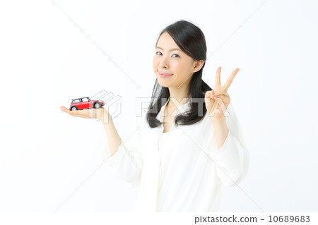 A young lady with a toy car 10689683