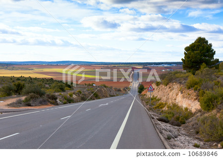 Empty rural road in Central Spain Empty rural road in Central Spain 10689846