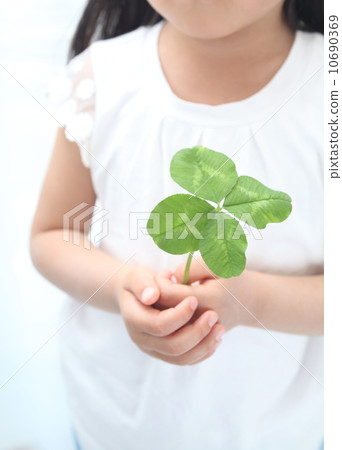 Four leaves clover and child 10690369
