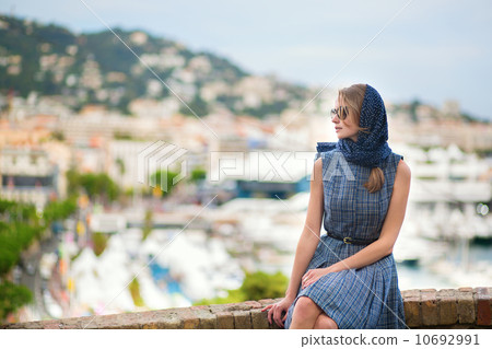 Elegant young woman in the Old town of Cannes 10692991