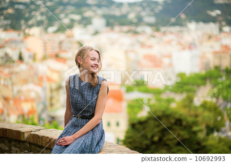 Elegant young woman in the Old town of Cannes 10692993