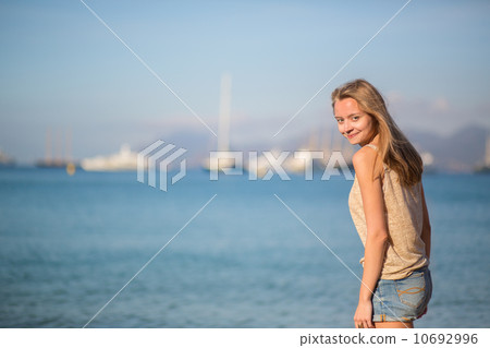 Happy girl on a beach 10692996