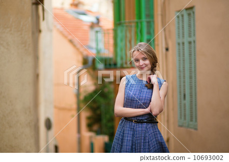 Elegant young woman in the Old town of Cannes 10693002