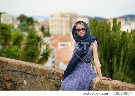 Elegant young woman in the Old town of Cannes 10693004