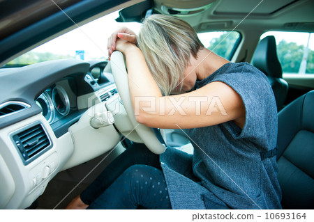 sad woman in her car sad woman in her car 10693164
