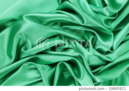 Soft folds and highlights of light green silk. 10695821