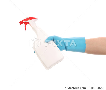 Hand in gloves holds spray bottle. 10695822