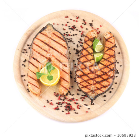 Beautiful salmon steaks on platter. 10695928