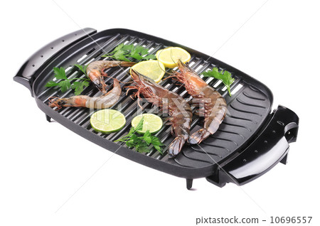 Fresh different shrimps on a grill. 10696557