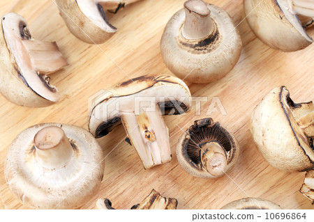 White mushrooms on wooden board. White mushrooms on wooden board. 10696864