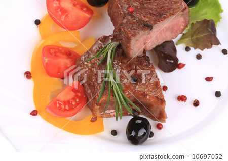 Grilled steak with fresh vegetables. Grilled steak with fresh vegetables. 10697052
