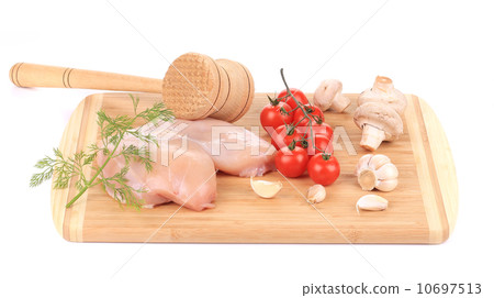 Raw chicken breast with tomatoes and mushrooms. Raw chicken breast with tomatoes and mushrooms. 10697513
