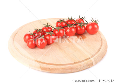 Cluster of Tomatoes on wooden platter. Cluster of Tomatoes on wooden platter. 10698012