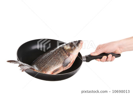 Carp fish on frying pan. 10698013