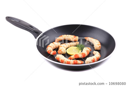 Cooked unshelled shrimp on frying pan. Cooked unshelled shrimp on frying pan. 10698080