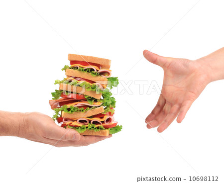 Big fresh sandwich in hands. 10698112