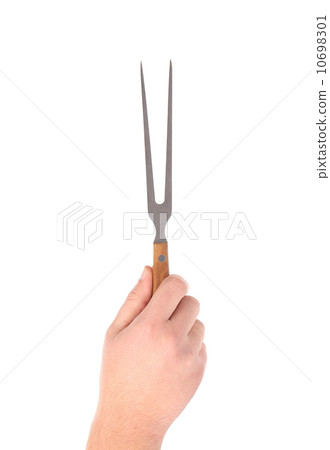 Hand holds fork. 10698301