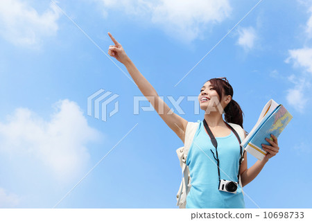 Happy women traveler pointing 10698733