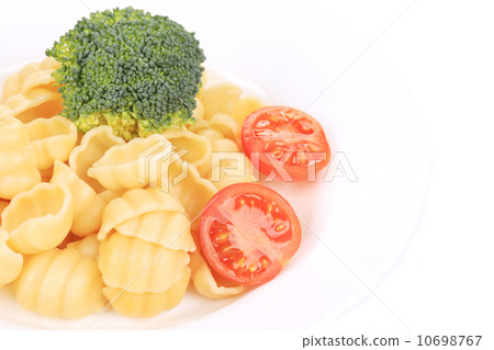 Pasta with broccoli and tomatoes. Pasta with broccoli and tomatoes. 10698767