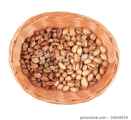 Wicker basket with pistachios. Wicker basket with pistachios. 10698859