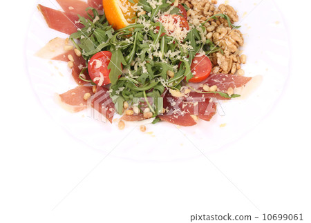 Salad with arugula and prosciutto. 10699061