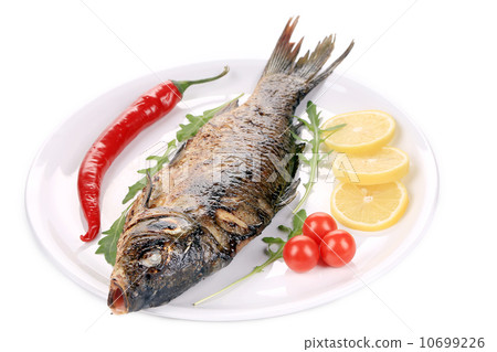 Fried fish on a white plate Fried fish on a white plate 10699226