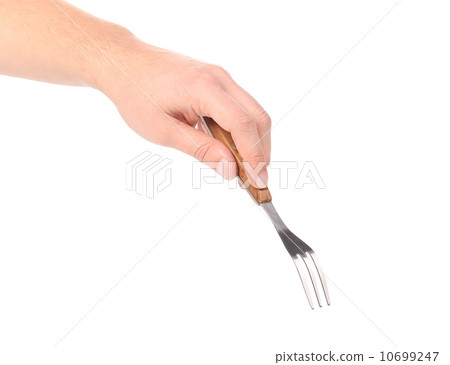 Close up of kitchen fork in hand Close up of kitchen fork in hand 10699247