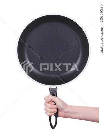 Hand holds a black frying pan Hand holds a black frying pan 10699559