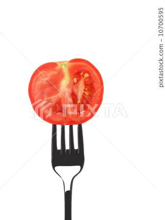 Red ripe tomato on fork. 10700595