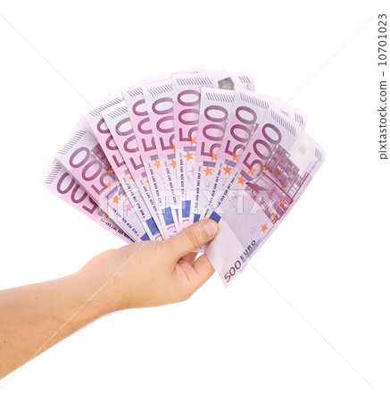 Hand holding five hundred-euro notes. Hand holding five hundred-euro notes. 10701023
